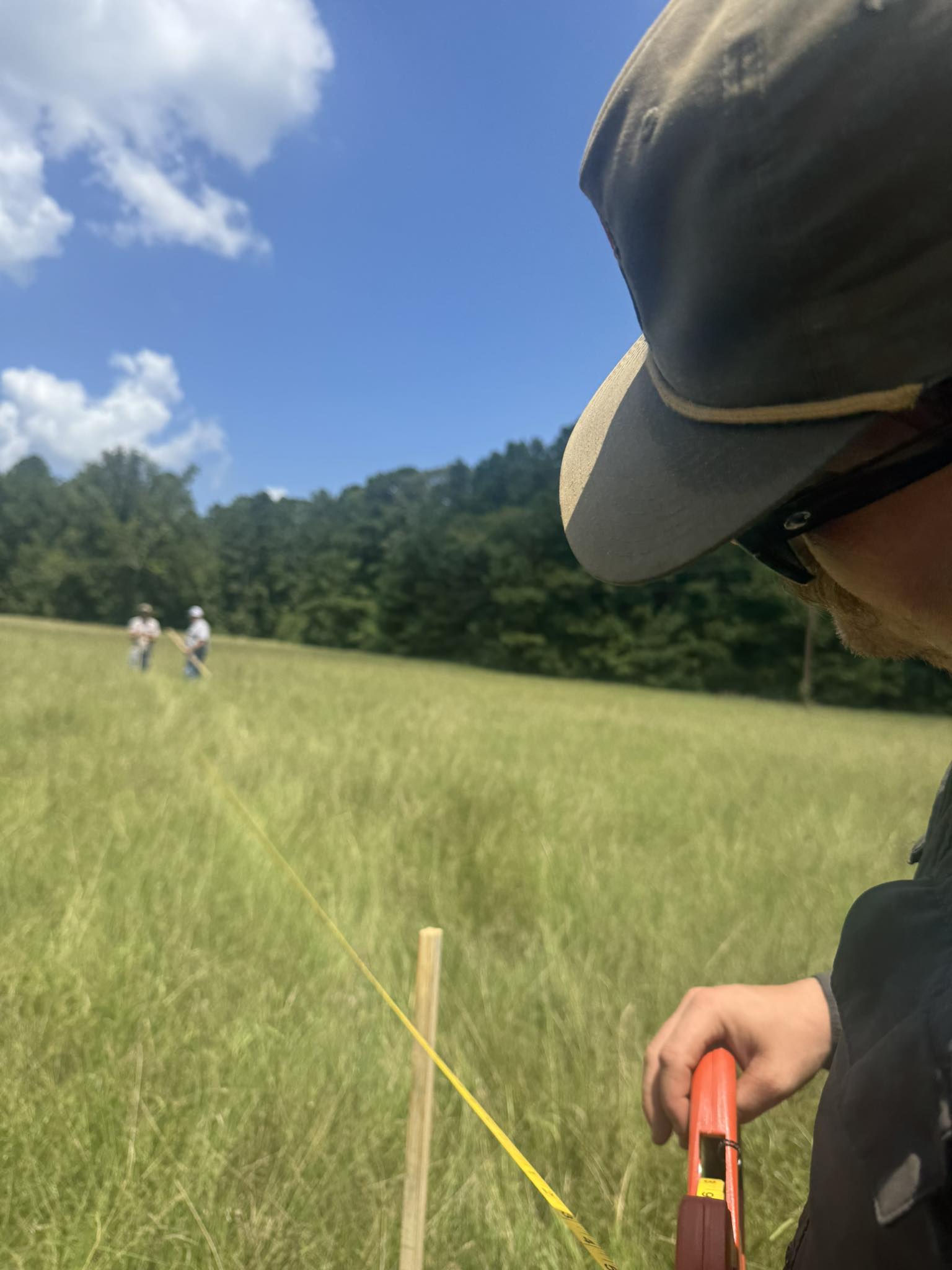 Crew members for JBC Excavation survey a site in Pineland, Texas